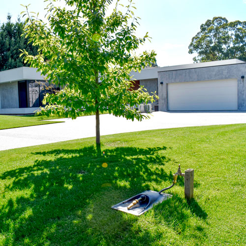 lawn installation of underground hose by rolaway